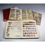 Four stamp albums / stock books containing various mid-century stamps of the World etc.
