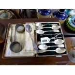 A boxed set of silver spoons and sugar tongs together with two napkin rings, another pair of sugar