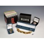 A Bradford Exchange Elvis Presley charm bracelet, cased; together with an Elvis limited edition UK