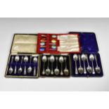 Four cased sets of silver teaspoons/coffee spoons, to include a set of silver gilt enamel coffee