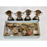 A rummage box to include silver trophies, RAF cap badges, assorted coins, lighters etc (qty)