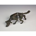 A bronze hound dog sculpture.