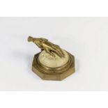 A novelty 19th century bronze desktop paper clip, in the form of a ladies left hand, the weighted