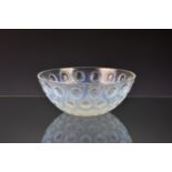 A Lalique Asters opalescent glass bowl, pre-war, with circular beaded decoration, 8in. (20.4cm.)