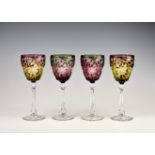 Two pairs of Stevens and Williams two-colour cut glass wine glasses, late 19th century, the ogee