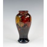 A Moorcroft flambé glazed vase, 1920s, of inverted baluster form, decorated in the Leaves and