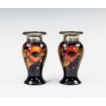 A pair of Moorcroft for Liberty & Co. Tudric pewter mounted pomegranate pattern vases, 1920s,