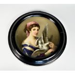 A 19th century Continental porcelain circular wall plaque, painted with a girl in blue dress holding