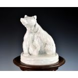 A Meissen blanc-de-chine porcelain figure of a bear modelled by August Gaul, the seated bear with