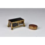 A late 19th century gilt-metal mounted banded agate casket, of plain rectangular form, raised on