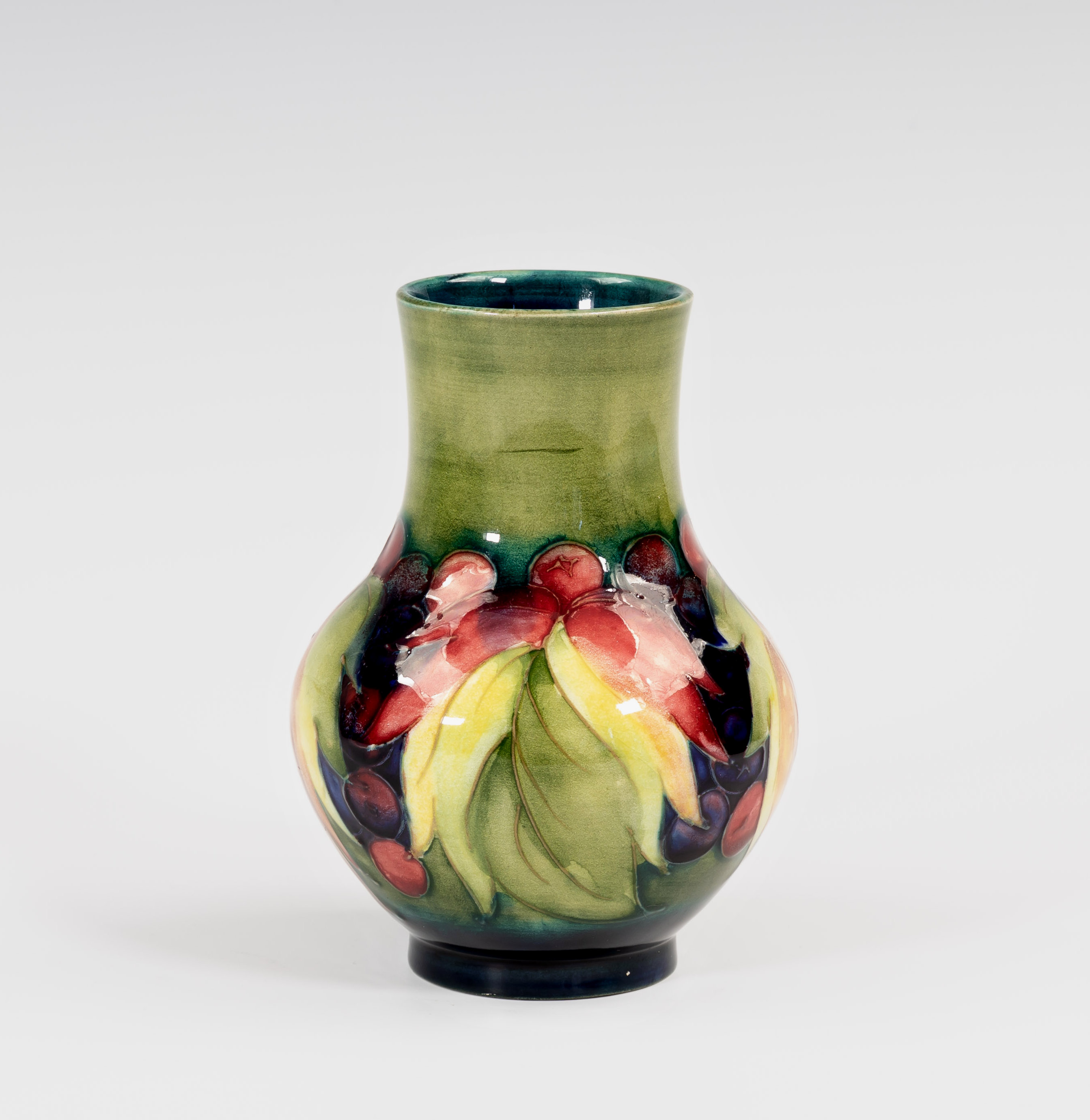 A Moorcroft Leaves and Fruit pattern vase, 1930s-40s, baluster form, painted on a graduated pale