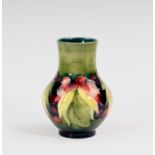 A Moorcroft Leaves and Fruit pattern vase, 1930s-40s, baluster form, painted on a graduated pale