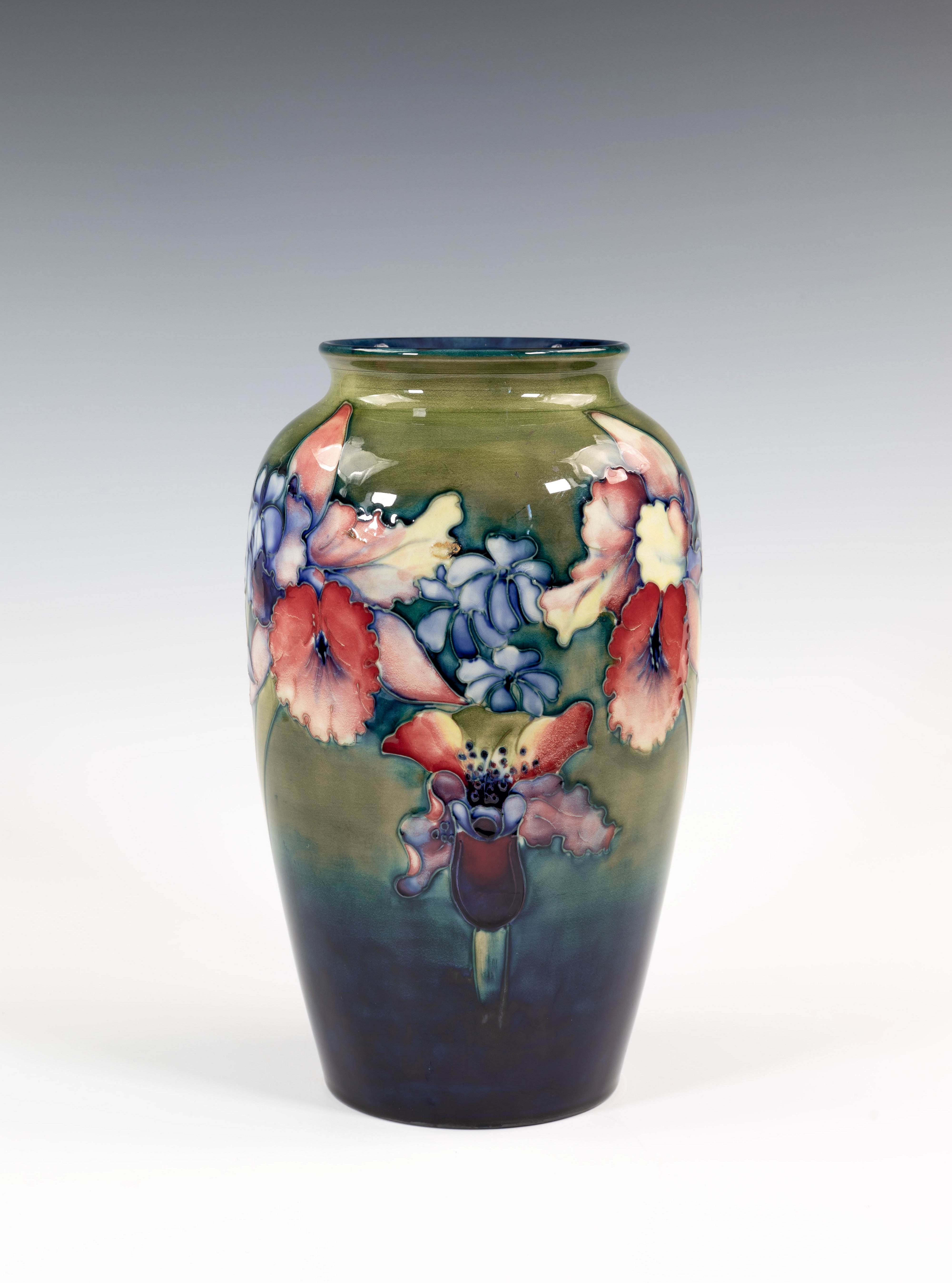 An early Walter Moorcroft Orchid vase, late 1940s, the ovoid form vase with short, waisted neck,