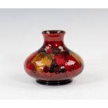 A Moorcroft flambé decorated vase, 1918-26 impressed marks with painted signature, of squat baluster