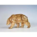 A Hutschenreuther porcelain figure of a bear, second half 20th century, in walking pose, decorated