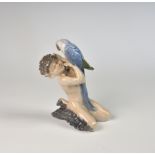 A Royal Copenhagen figure of a faun and parrot by Christian Thomsen, 1920s, green crown and