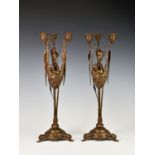 Auguste Nicholas Cain (French, 1821-1894), a pair of mid-brown patinated bronze three branch