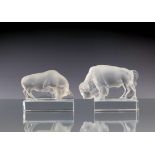 A 20th century Lalique paperweight, modelled as a Taureau, the clear crystal block rising to a