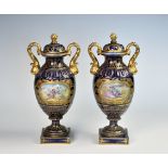 A pair of Continental blue-ground porcelain covered vases, late 19th / early 20th century, the ovoid