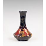 A Moorcroft pomegranate pattern bottle vase, 1920s, of shouldered, bottle form with slightly