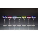 A set of seven Val St. Lambert coloured cut hock glasses, the flashed shallow cup shaped bowls