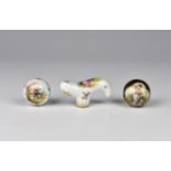 Three antique porcelain walking cane or parasol handles, in the Meissen and Sevres styles,