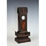 A rare Chinese carved hardwood watch stand, 19th century, in the form of a monument, the top