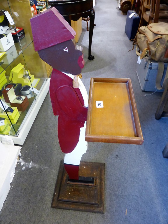 A 20th century painted wood bell boy figural dumb waiter.