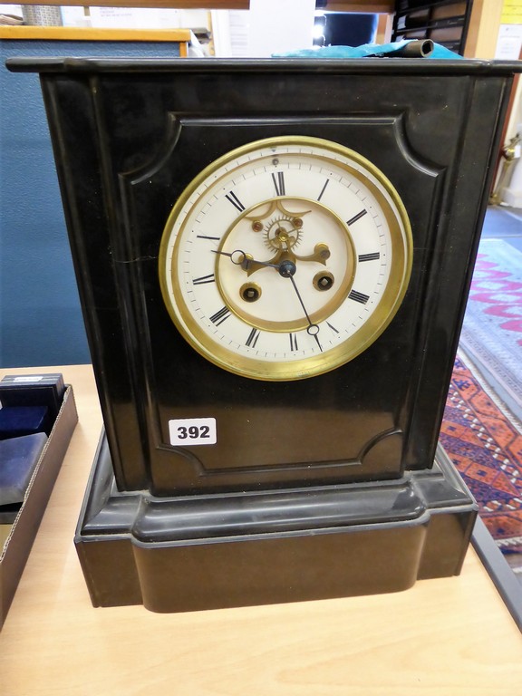 A Victorian black slate mantel clock