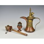 An 18th or 19th century Middle Eastern Persian copper and brass Dallah coffee pot, with flared