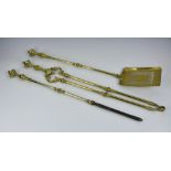 A three piece Georgian brass fireside companion set, comprising of poker, shovel and tongs, each