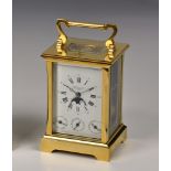 A brass repeating carriage clock by Searle & Co. Ltd., Royal Exchange, London with complications, in