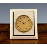 An Art Deco ivory and tortoiseshell desk clock, the bevelled ivory plate with tortoiseshell