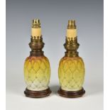 A pair of Victorian novelty satin glass oil lamps, probably by Thomas Webb, in the form of