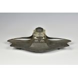 An Art Nouveau pewter inkstand by Orivit, with glass inkwell with pewter hinged cover, signed '"