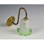 A set of four Edwardian style brass and etched glass wall lights, the S-shaped brass arms on