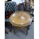 A circular side table with pierced brass gallery.