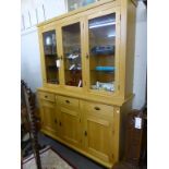 A light oak glazed dresser.