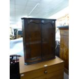 A 1920's small mahogany corner cupboard.