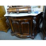 A good quality Victorian rosewood serpentine chiffonier with marble top,the arched foliate carved