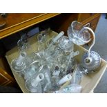 A clear glass 8 branch electrolier with S shaped arms and faceted tear drops,