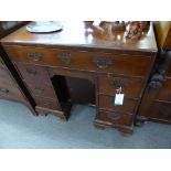 A George III mahogany kneehole dressing table,the caddy moulded top over a fitted full width top