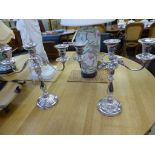 A pair of silver plated two branch candelabra,