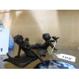 Ernest Justin Ferrand (1846-1932) - a small bronze figure of a pixie,mid-brown patination, seated