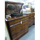 A 19th century French mahogany dressing chest,the slab top with fitted swing mirror with split