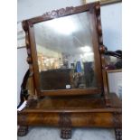 An exceptionally large 19th century Channel Islands cross banded mahogany swing mirror,the