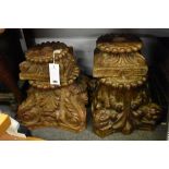 A pair of 18th century carved walnut column capitals,carved with foliate scrolls and a beaded