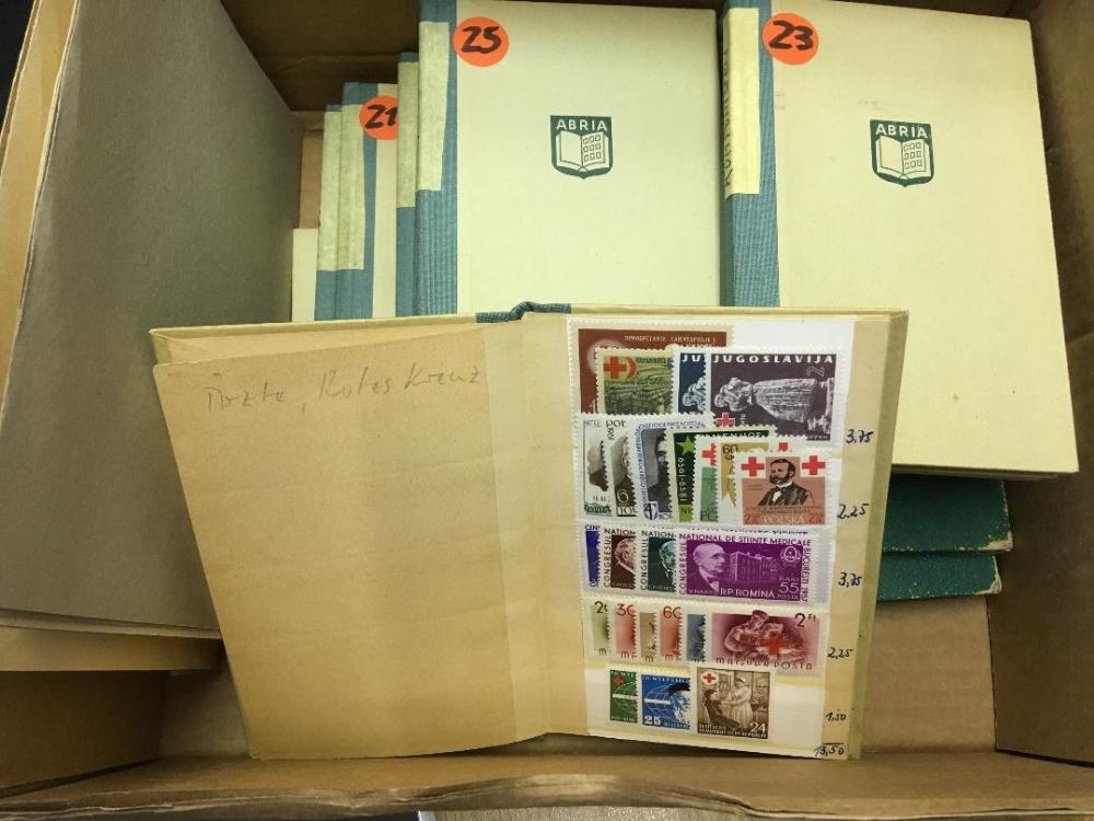 STAMPS : WORLD, un-mounted accumulation in seventeen pocket stockbooks & six small paper files.