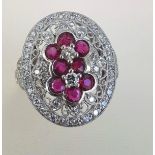 Ruby and Diamond Platinum Mounted Filigree Decorated Ladies Oval Ring of Good Colour