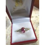 Pink Topaz and Diamond Decorated 9 Carat Gold Ring Centre Stone of Oval Cut Form